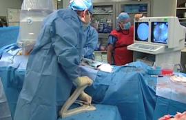 Surgeon using contrast Injector