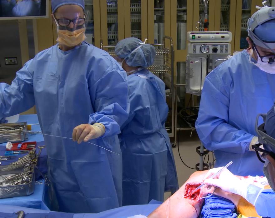 Surgical Tech handing surgeon valvulotome